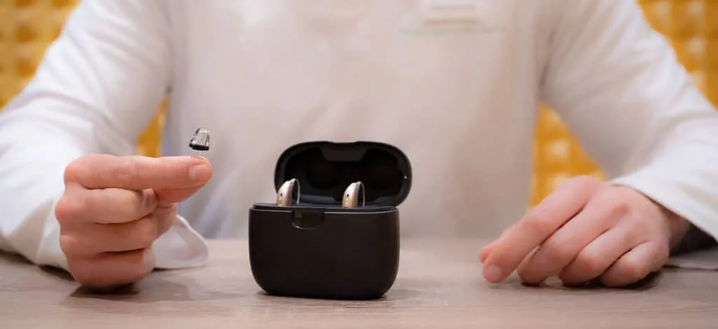 Close-up comparison of discreet hearing aids