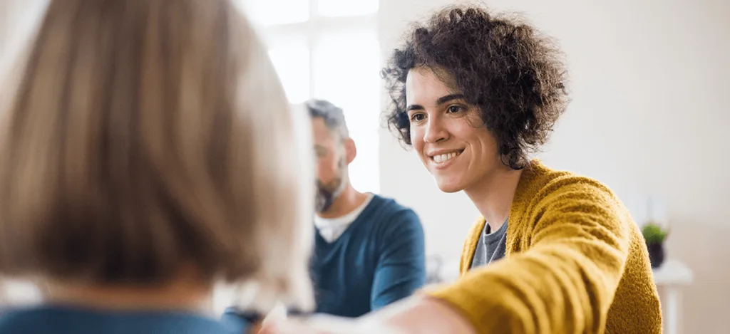 Smiling person enjoying a conversation
