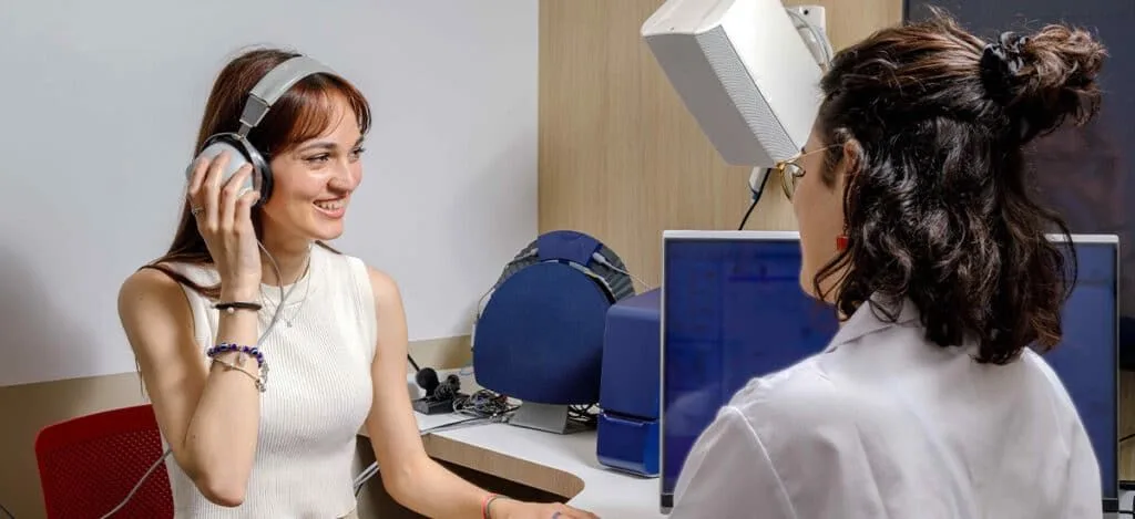 Young adult wearing a discreet hearing aid